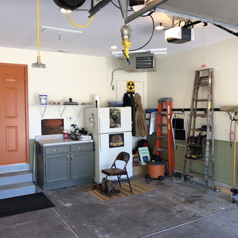 Organized garage with ladders, storage, and tools - Muzzy from Romeoville, IL