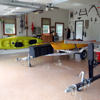 Organized garage with kayaks, trailers, and wall tool racks - Kayakjohn from Mount Nebo, WV