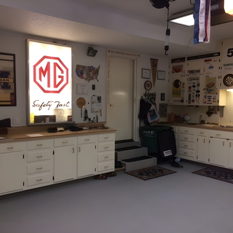 MG Themed Garage with White Cabinets and Wall Decor - Lon from West Des Moines, IA