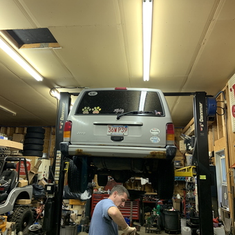 Jeep on Two-Post Lift with Tools in Garage - Capcamaro from Belchertown, MA