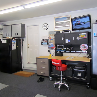 Organized garage with workbench, storage cabinets, and Snap-On stool - Joe from Old Hickory, TN