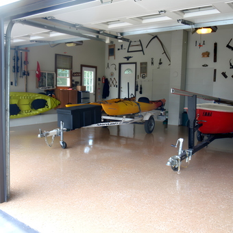 Organized garage with kayaks, boat trailers, and wall tool storage - Kayakjohn from Mount Nebo, WV