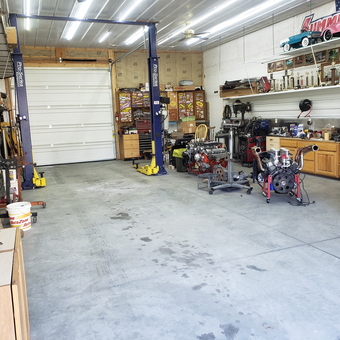 Organized garage with car lift, engines, and workbenches - Cliff from Corvallis, MT