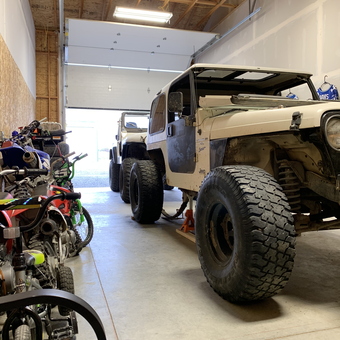 Garage with Jeeps on Jack Stands and Dirt Bikes - Tyler from Moses Lake, WA