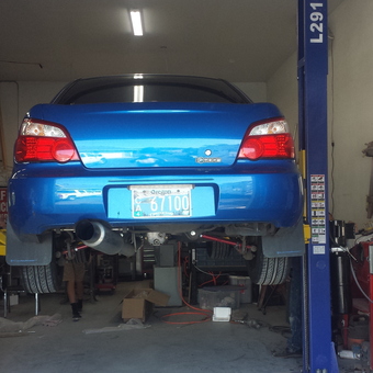 Blue Subaru on Two Post Lift in Organized Garage - Ken from Roseburg, OR