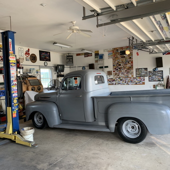 Classic Truck, Car Lift, and Toolboxes in Organized Garage - Art from Port Clinton, OH