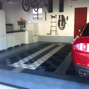 Organized garage with cabinets, floor tiles, and red car - Ken from Thousand Oaks, CA