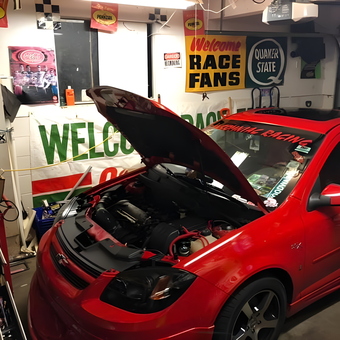 Race Inspired Garage with Red Car and Wall Signs - Gregory from Grand Blanc, MI