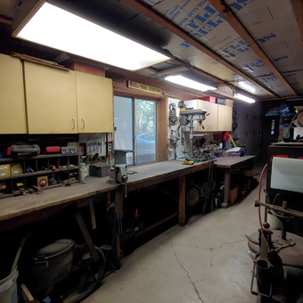 Organized garage workbench with storage cabinets and tools - Michael from Ann Arbor, MI