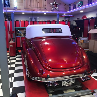 Classic Car on Lift, Red Cabinets, Neon Signs - Joe from BOHEMIA, NY