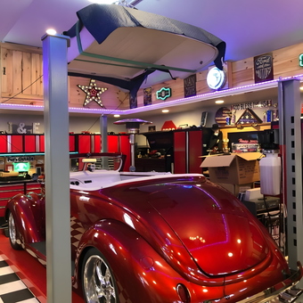 Classic Car on Lift with Red Cabinets and Neon Signs - Joe from BOHEMIA, NY