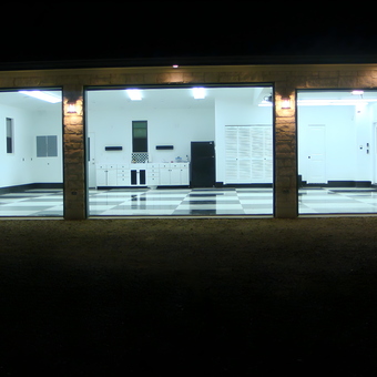 Spacious garage with checkered floor and cabinets - Ken from New Braunfels, TX