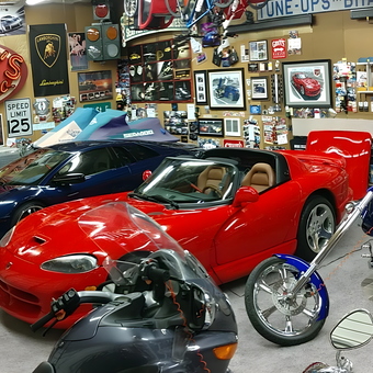 Garage with sports cars, motorcycles, decor, and sofa - Dave from Auburn, WA