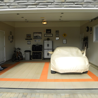 Organized garage with car cover, cabinets, and wall art - Dennis from Thunder Bay, ON Canada