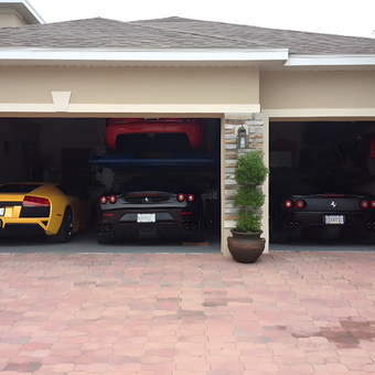 Luxury Sports Cars and Car Lift in Modern Garage - Thai from Orlando, FL