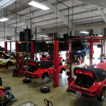 Multiple Rotary Car Lifts and Tire Racks in Busy Garage - chip from POWELL, OH