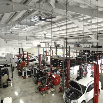 Spacious garage with car lifts, tire racks, and workbenches - chip from POWELL, OH