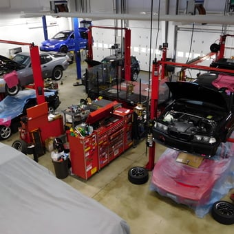 Professional garage with car lifts and tool storage - chip from POWELL, OH