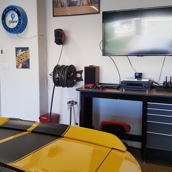 Garage with Yellow Sports Car, TV, Hose Reel, and Mopar Sign - Jeffrey from Cheyenne, WY