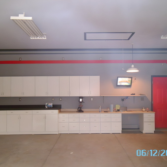 Modern Garage With White Cabinets and Red Door - Michael from Bowling Green, KY