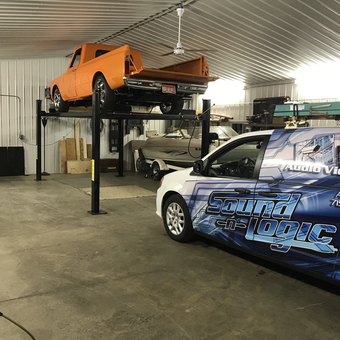 Spacious Garage With Car Lift and Vehicles - Travis from Rice Lake, WI