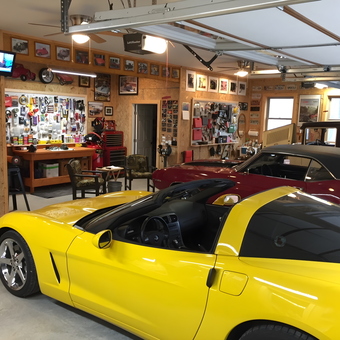 Organized garage with workbench, pegboards, and classic cars - Ken from Jasper, GA