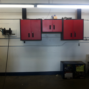 Red Wall Cabinets and Hose Reel in Garage - Butler from Ashland, OR