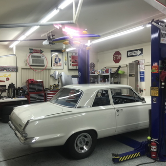 Classic Car Garage with Lift, Toolboxes, and Signs - BILL