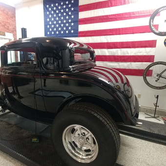 Classic Car on Lift with Wall Decor and Bicycles - Greg from Boise, ID