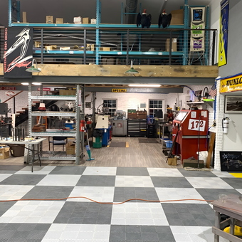 Garage with Checkered Flooring, Workbenches, and Storage - Thomas