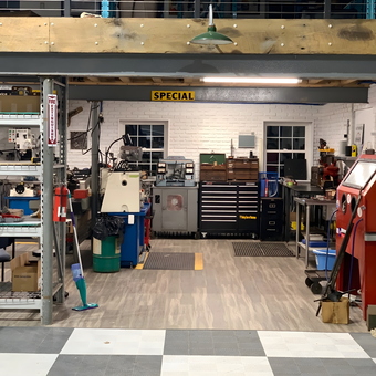 Organized garage workspace with tool cabinets and sandblaster - Thomas