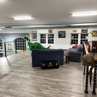 Garage Loft with Retro Signs, Dino Statue, and Lounge Area - Thomas