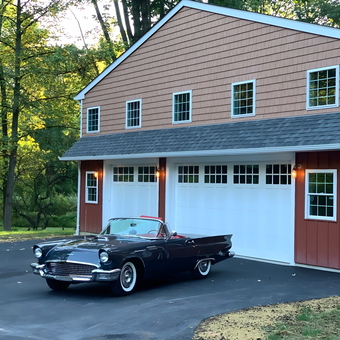 Classic Car Garage With White Doors and Lighting - Thomas
