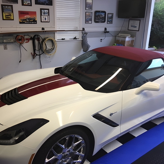 Organized garage with Corvette, wall racks, and decor - JOHN from ENTERPRISE, AL