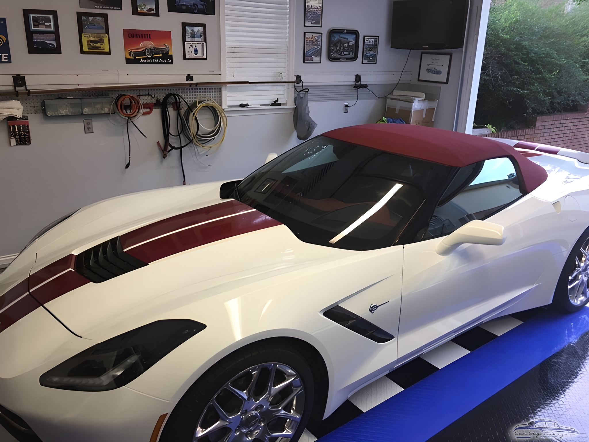 Organized garage with Corvette, wall racks, and decor - JOHN from ENTERPRISE, AL