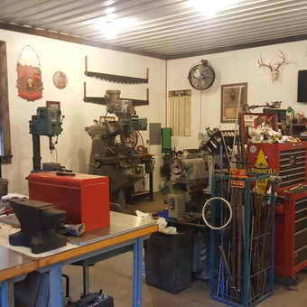 Organized garage with toolboxes, workbenches, and machines - Pineknot from New castle, VA