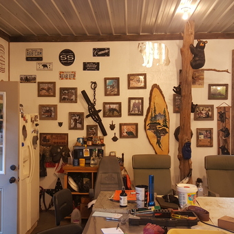 Rustic garage with wall art, tools, and decor - Pineknot from New castle, VA