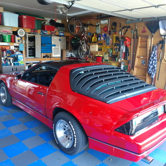 Organized garage with Camaro IROC-Z, tool storage and wall racks - Heath from Hammond, WI
