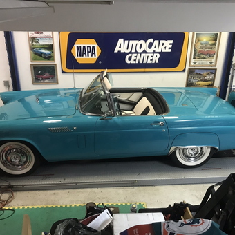 Classic Blue Convertible on Lift with Garage Signs - Gary from Miami, FL