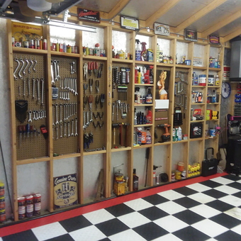Organized garage wall with tools, storage, and decor - Wally from Carson, CA