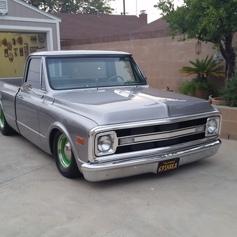 Organized garage with classic silver truck and wall decor - Wally from Carson, CA