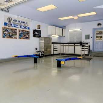 Organized garage with car lift, cabinets, and tool storage - Erik M. from Concord, CA