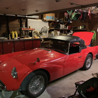 Classic red convertible in organized garage - Eric & Jennifer from Bluffton, IN
