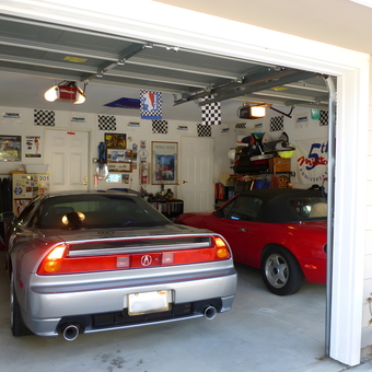 Organized garage with race decor and sports cars - Ted from Brisbane, CA
