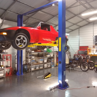 Organized garage with car lift, classic car, and motorcycles - Wes from Greensboro, NC