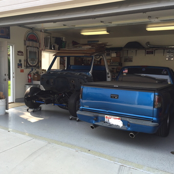 Organized garage with blue trucks and wall decor - Odyssey from Boise, ID