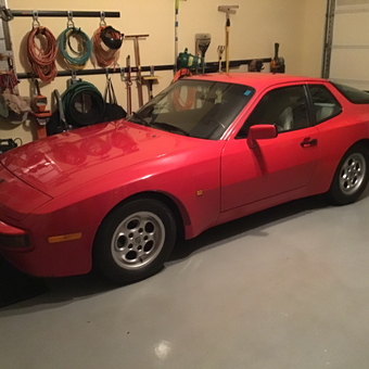 Organized garage with red sports car and wall storage - George from Lewes, DE