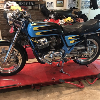 Classic Motorcycle on Red Lift Table in Garage - Mouse from Brooklyn, NY