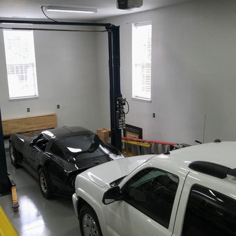 Two-post car lift and workbench in organized garage - Duane from Nashville, TN
