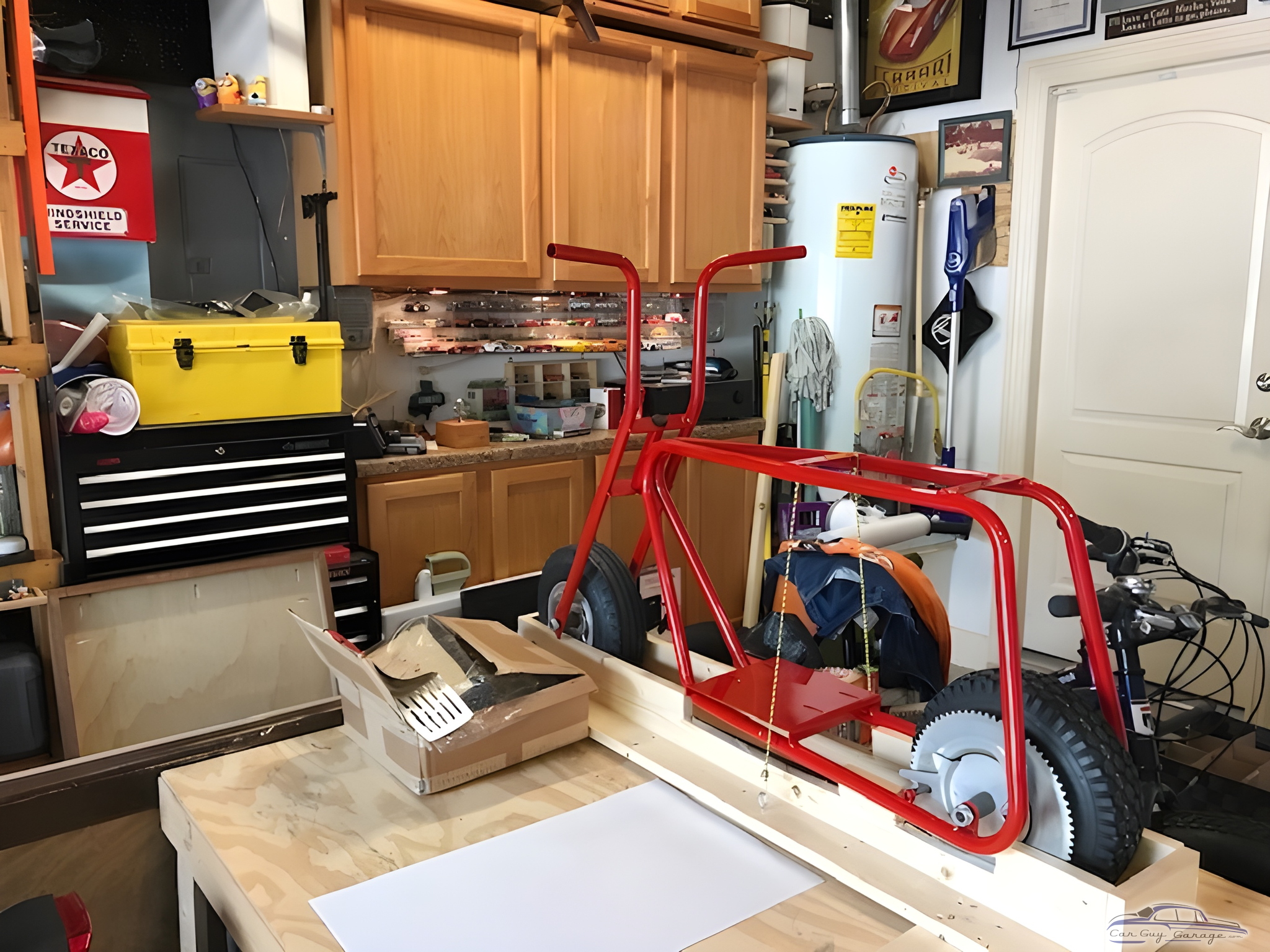 Organized garage workspace with tool chest and minibike frame - Mike from Houston, TX